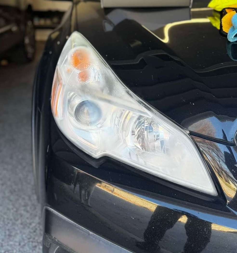 Headlight Restoration Before - Mobile auto detailing in Omaha